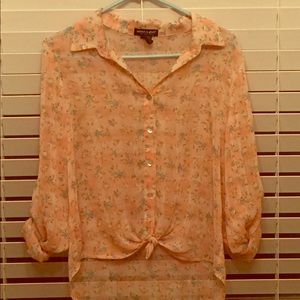 About A Girl pink somewhat see through shirt.